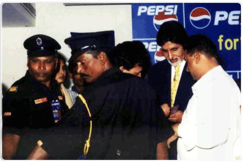 Mr. Amitab Bachan being escorted by our Bodyguards (towards his left & right) and our Security Guards (extreme right)