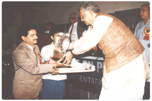 Our CMD receiving the Ratnashrimoni award at the Parliament Club, New Delhi.